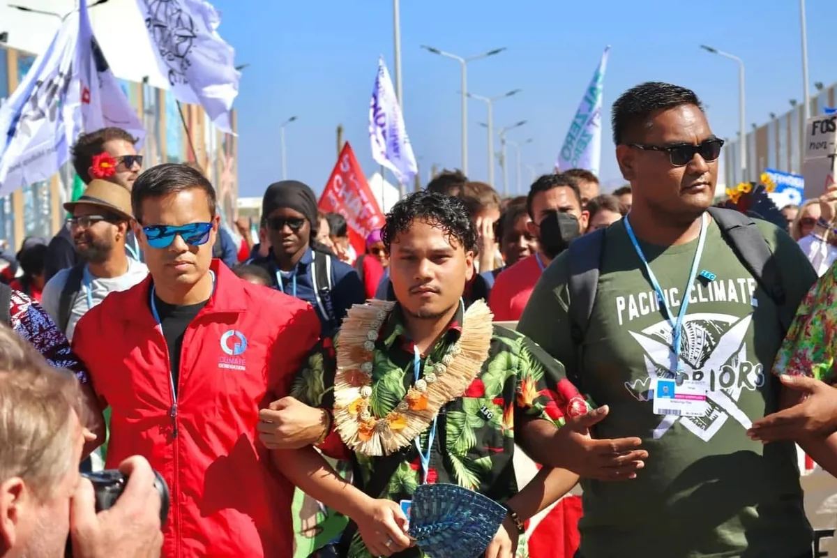 Pacific climate advocates walking together at a climate march