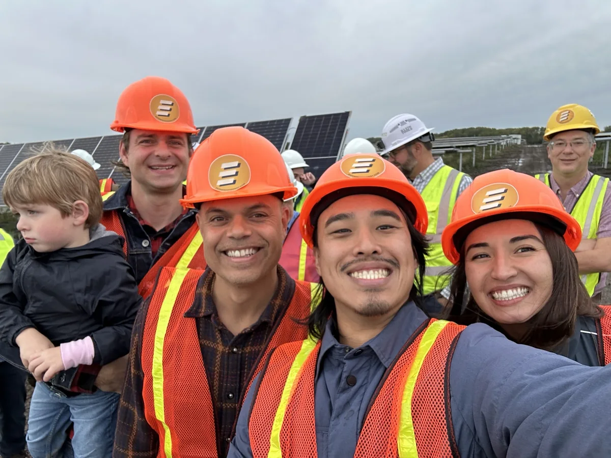 Eric and colleagues visiting a community solar project